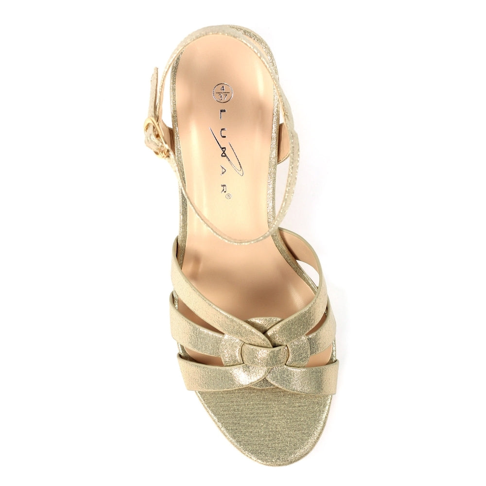 Gold sandal with criss-cross straps on a white background