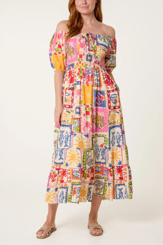 Woman wearing a colorful off-shoulder dress with a pattern on a white background