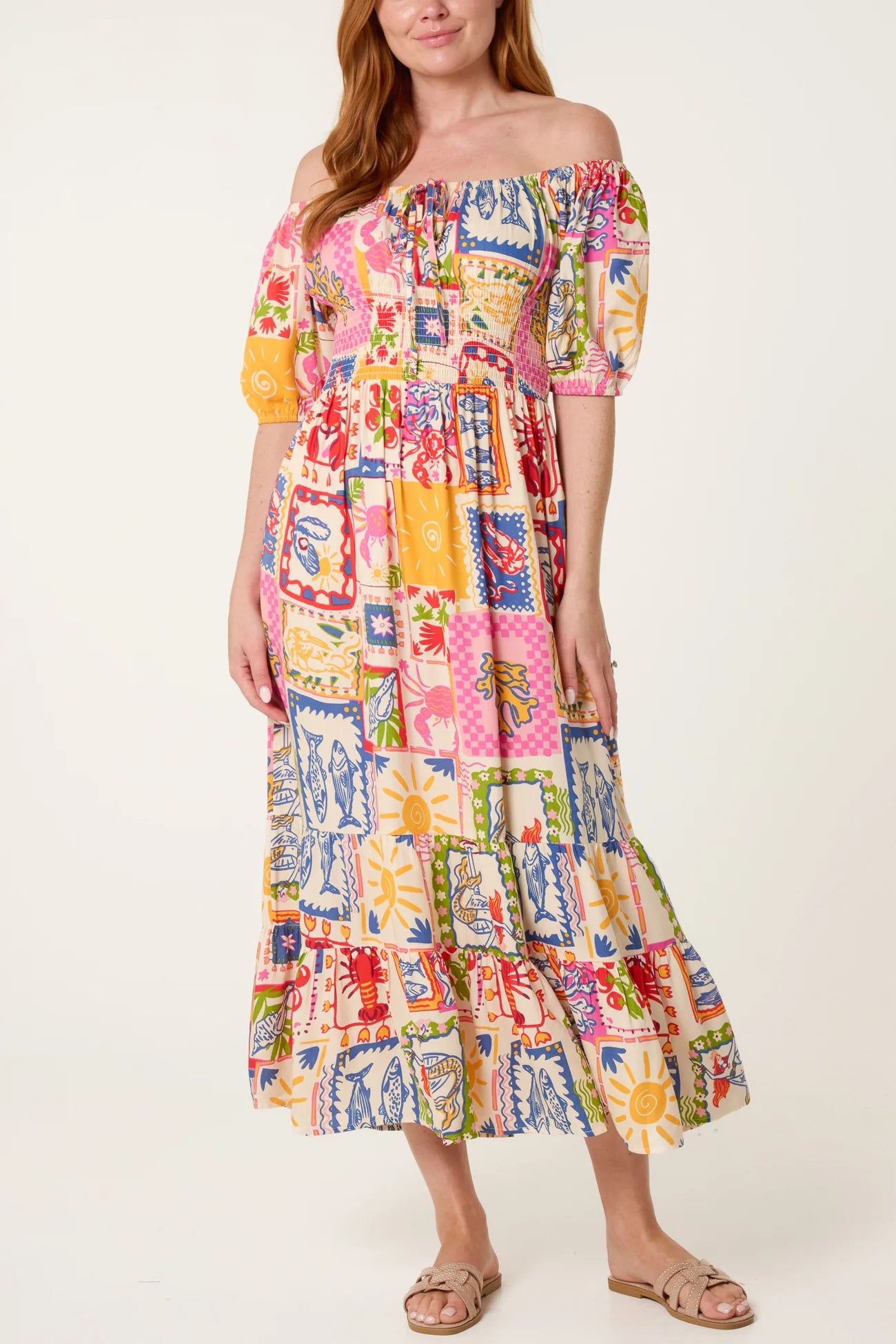 Woman wearing a colorful patchwork dress on a white background