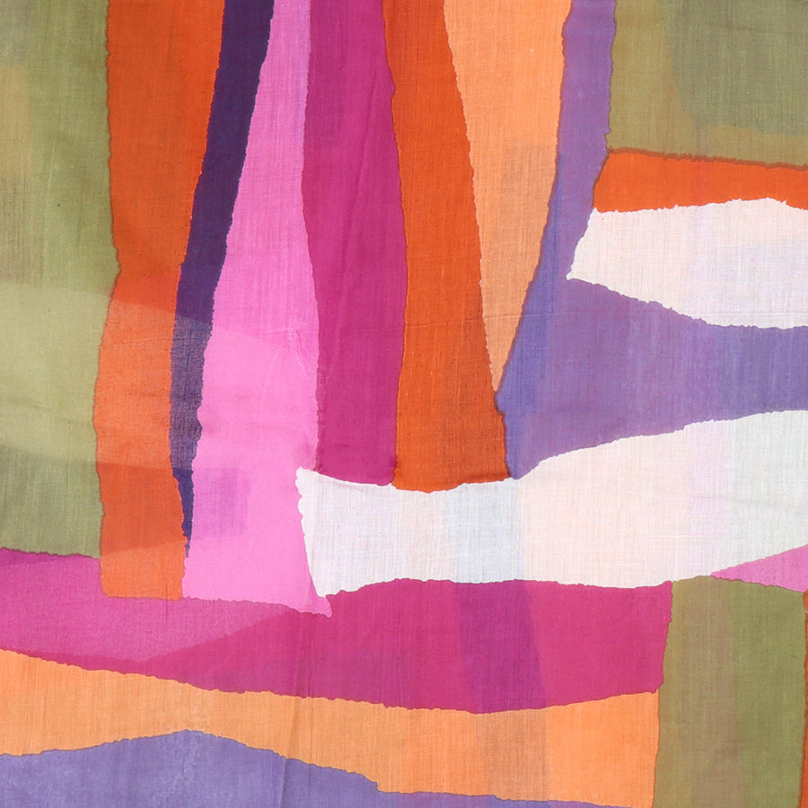 Colorful abstract fabric pattern with shades of orange, pink, purple, and green.
