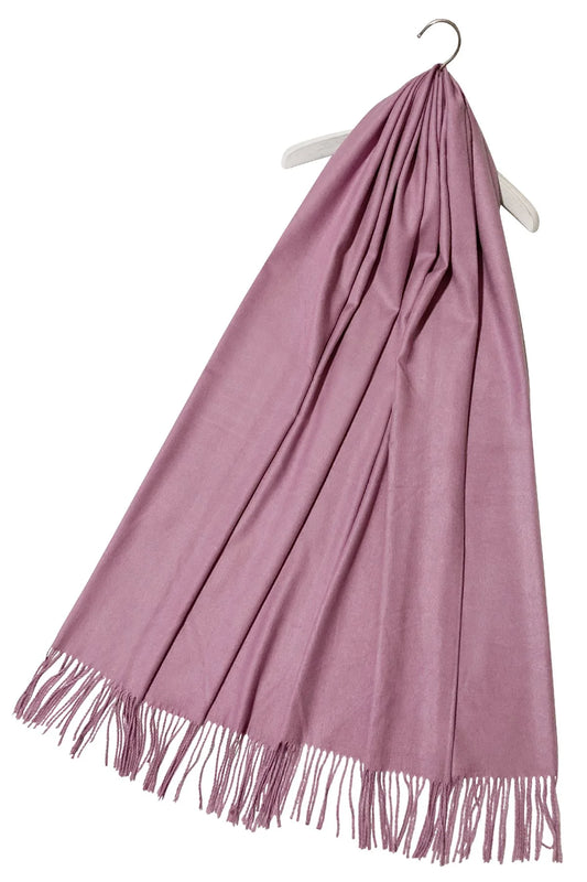 Pink scarf with fringes on a white background