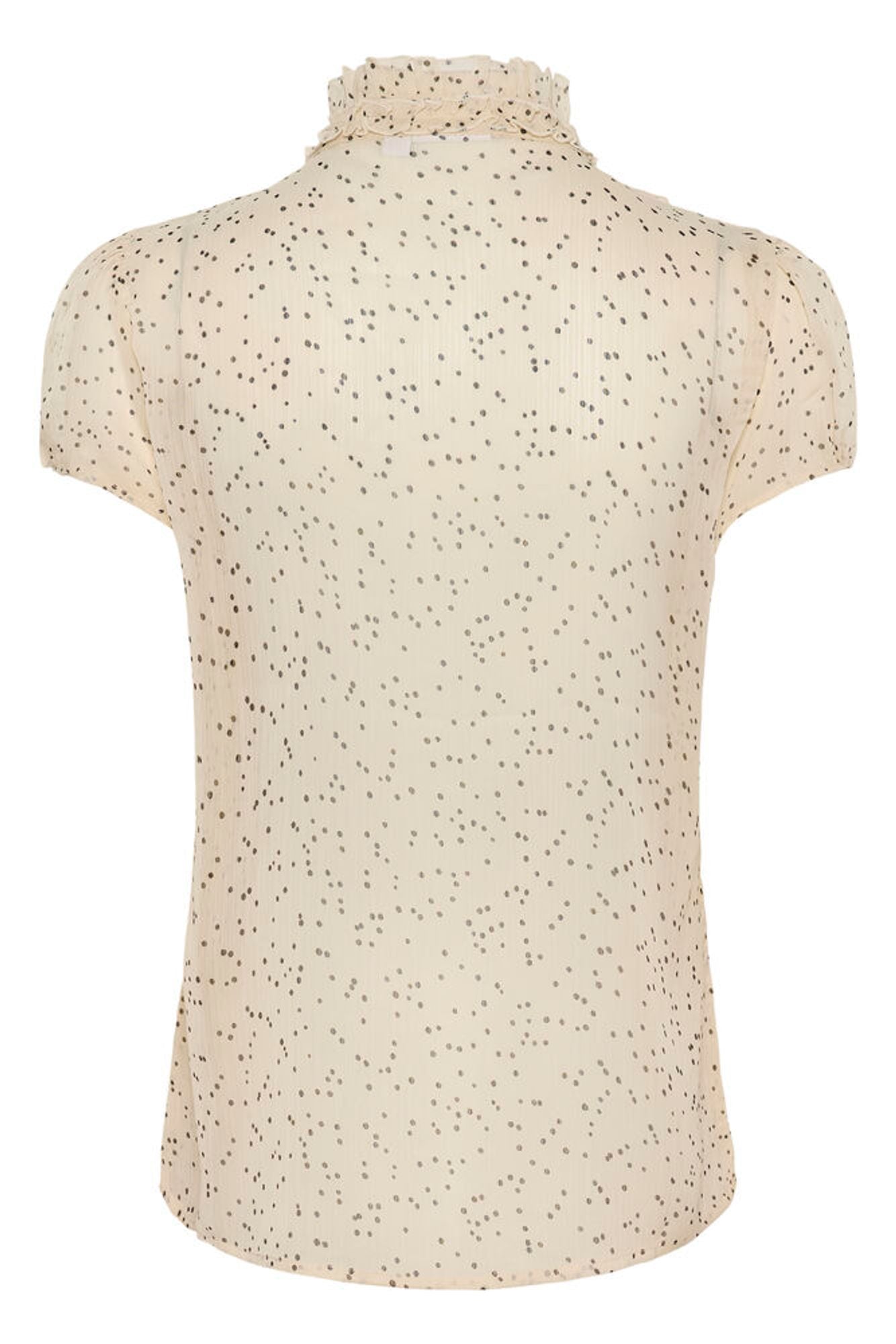 Beige sleeveless top with a pattern on a white background
