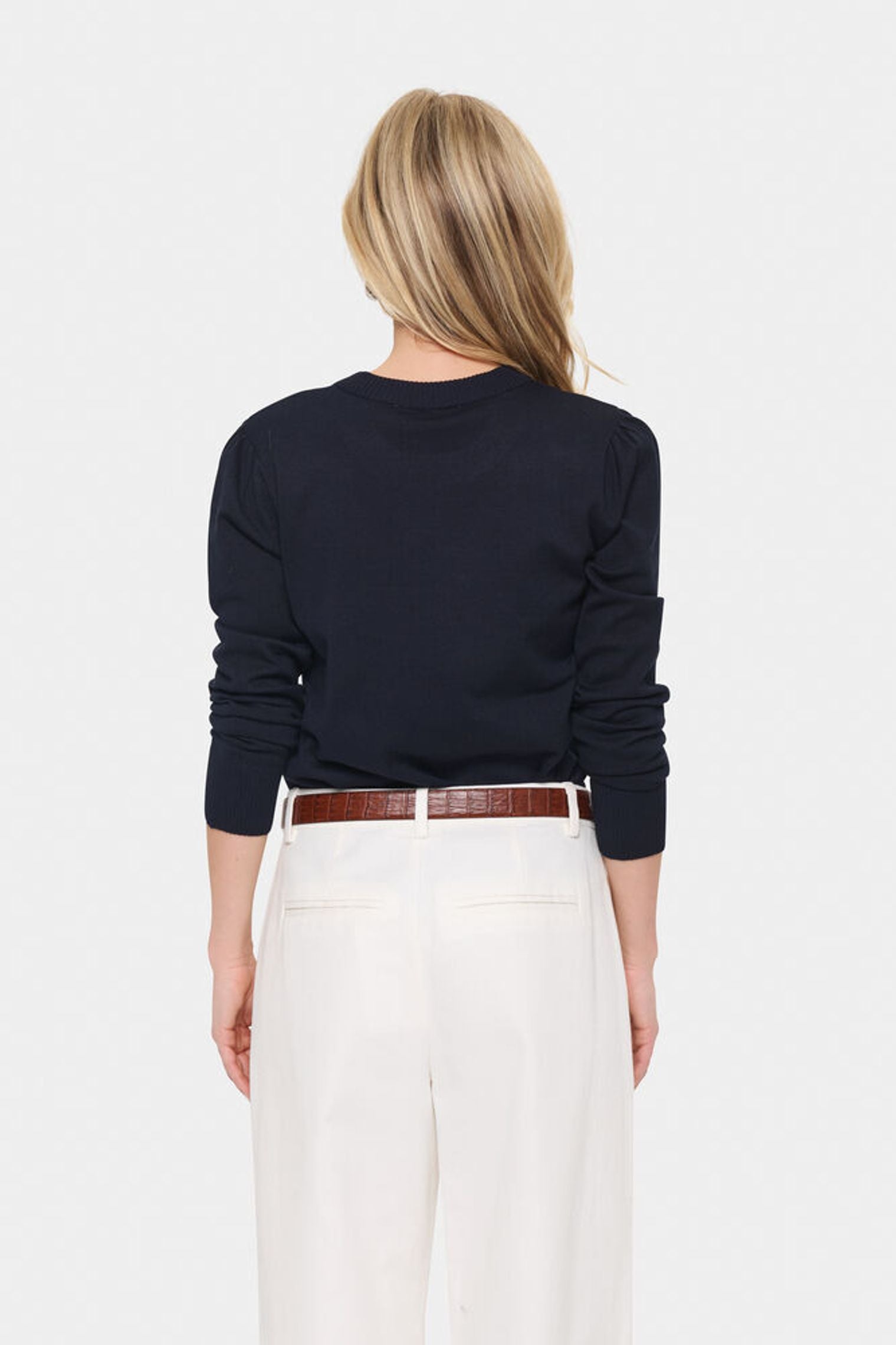 Back view of model in navy blue jumper