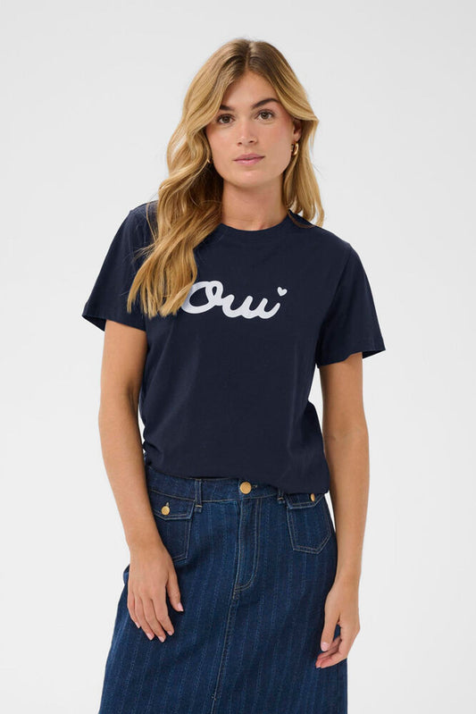 Model in navy t-shirt with Oui logo
