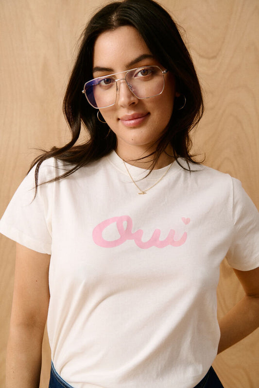 Model in white t-shirt with Oui logo
