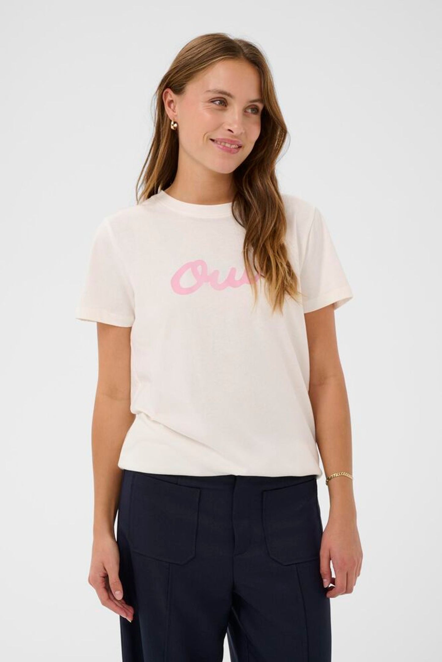 Model in white t-shirt with pink oui logo