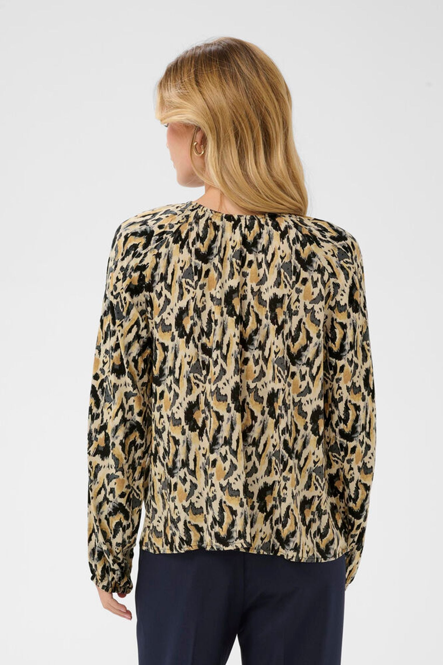 Back view of model in animal blouse 
