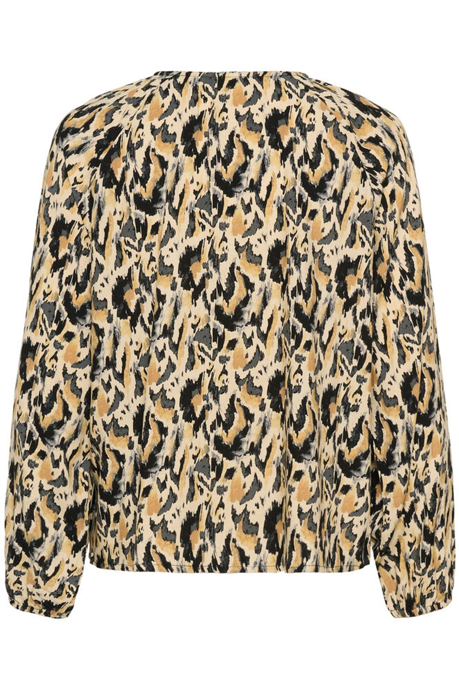 Flat lay of the back of animal blouse on white background 