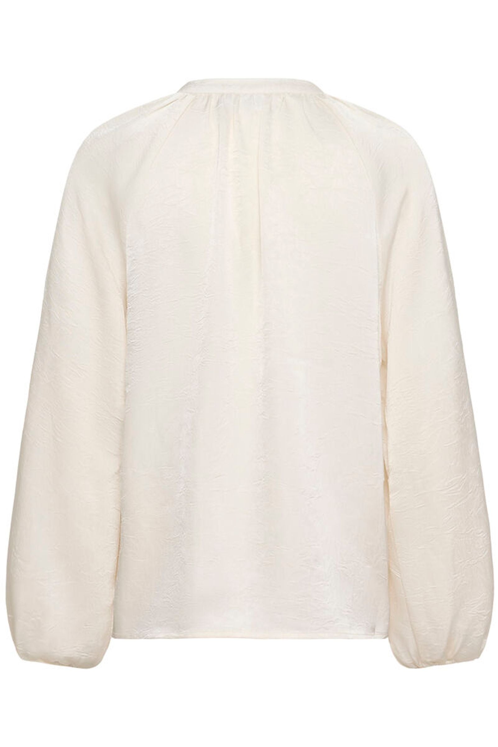 White blouse with long sleeves on a white background