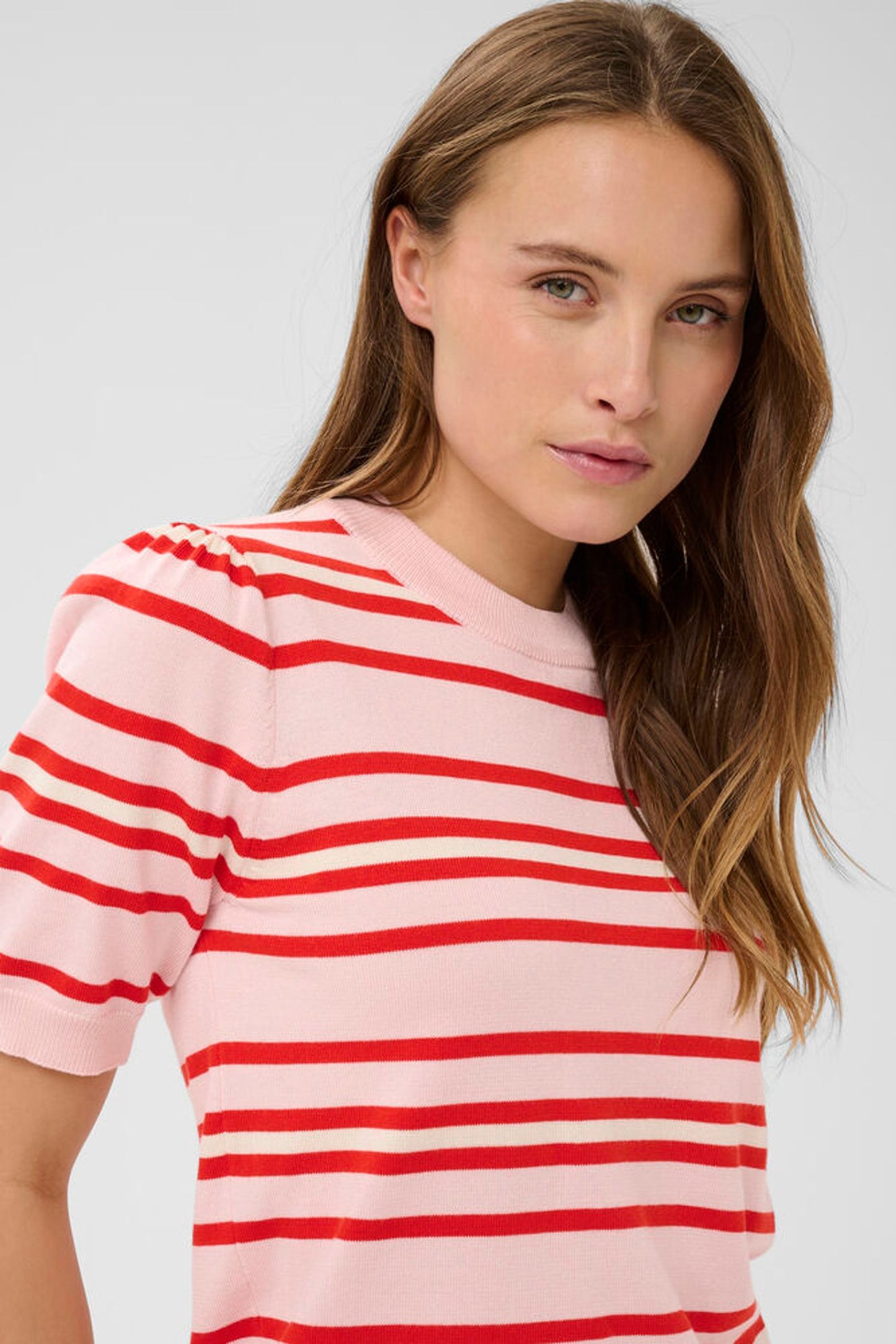 Close up of pink knit with red stripes