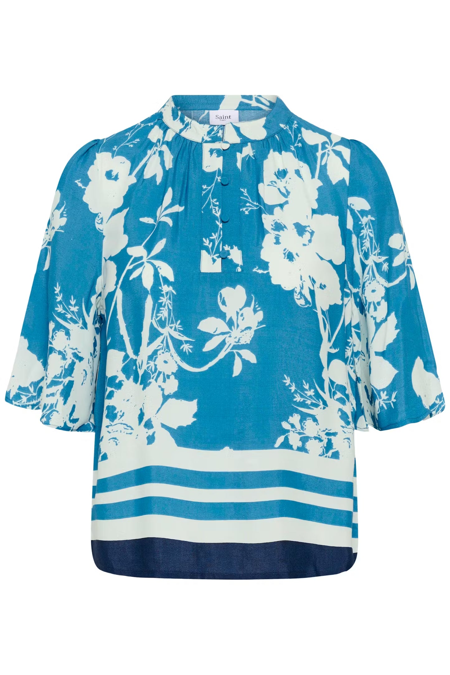 Blue blouse with white floral pattern on a white background