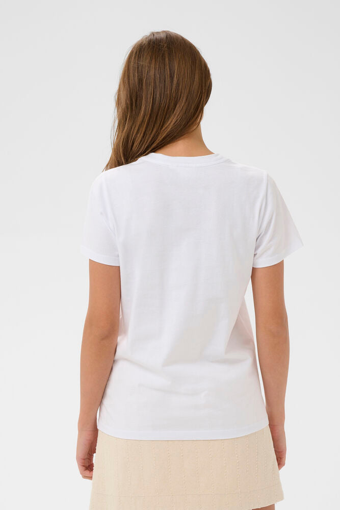 Woman wearing a plain white t-shirt on a light gray background