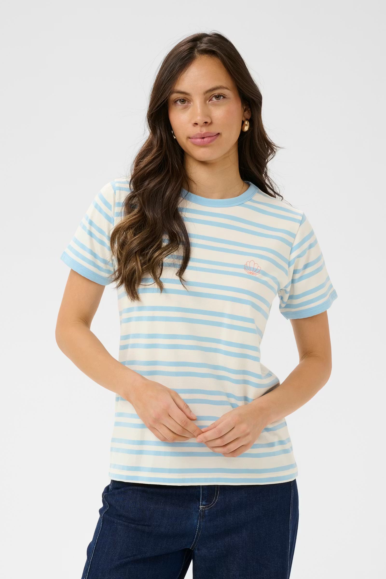 Woman wearing a blue and white striped shirt against a plain background