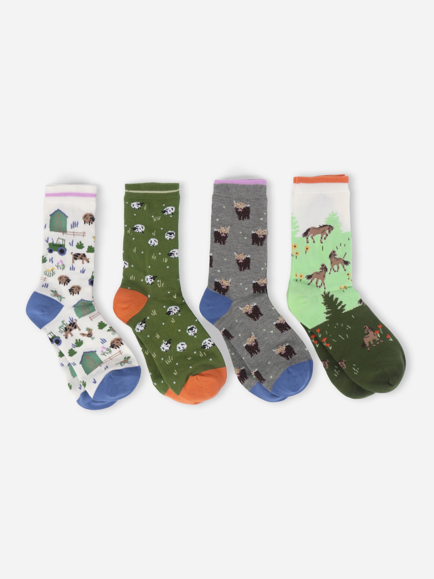 Four pairs of socks with animal patterns on a white background