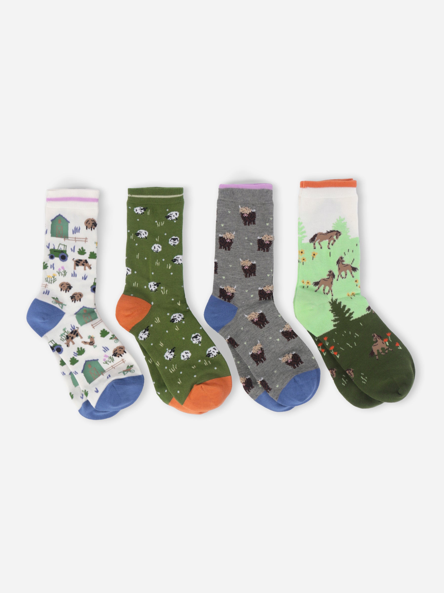 Four pairs of socks with animal patterns on a white background