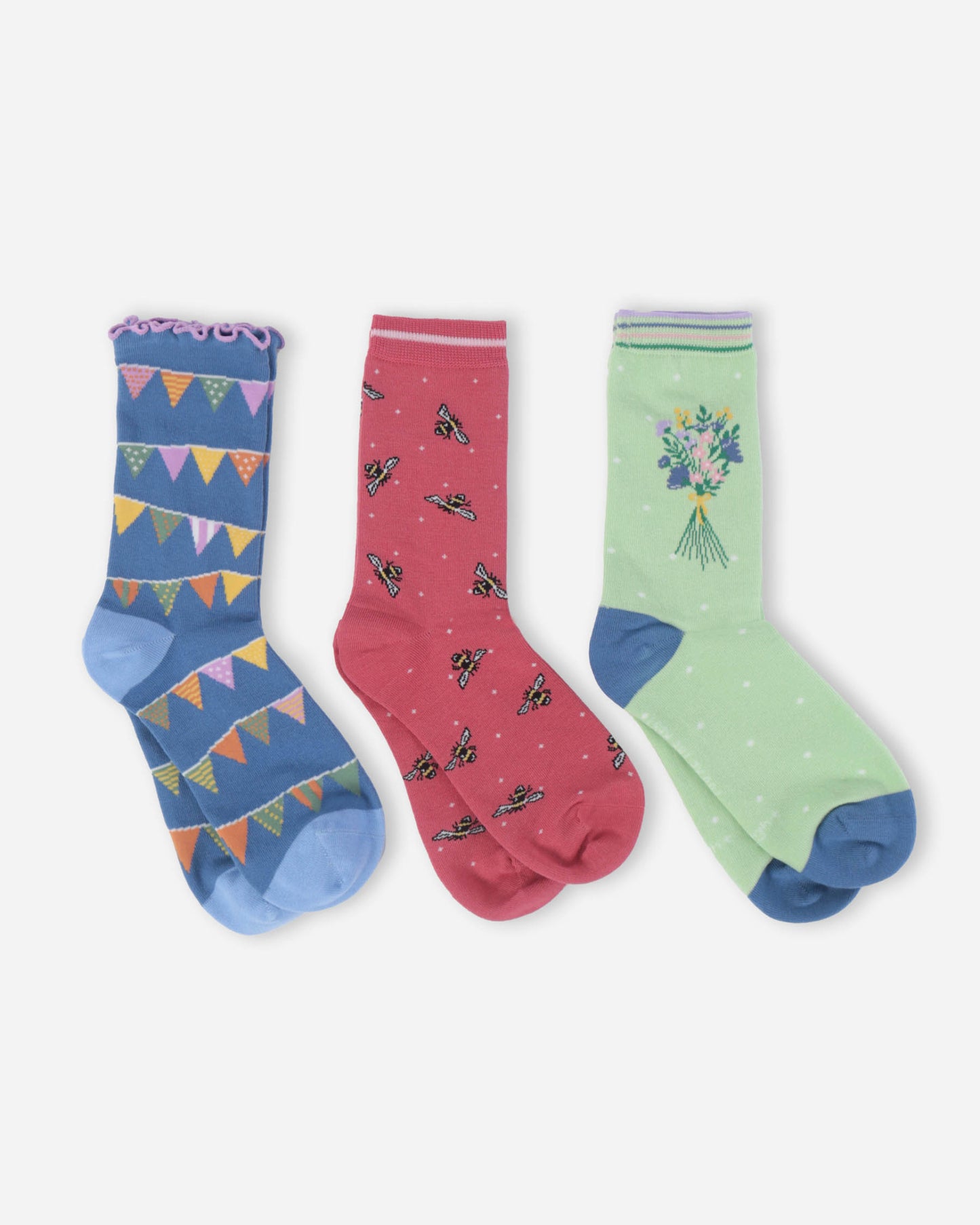 Three pairs of colorful socks with different patterns on a white background