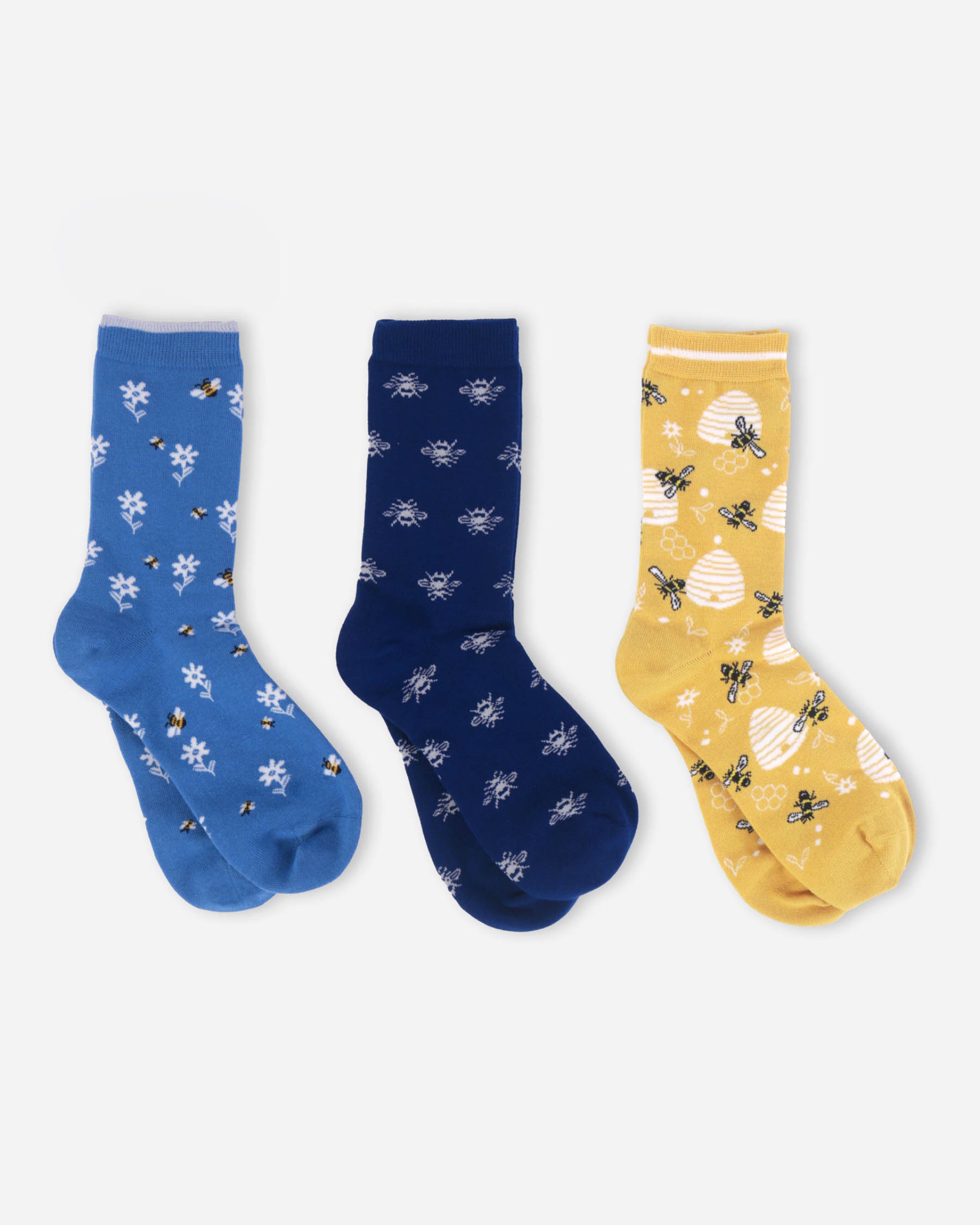 Three pairs of socks in blue, navy, and yellow with floral and bee patterns on a white background.