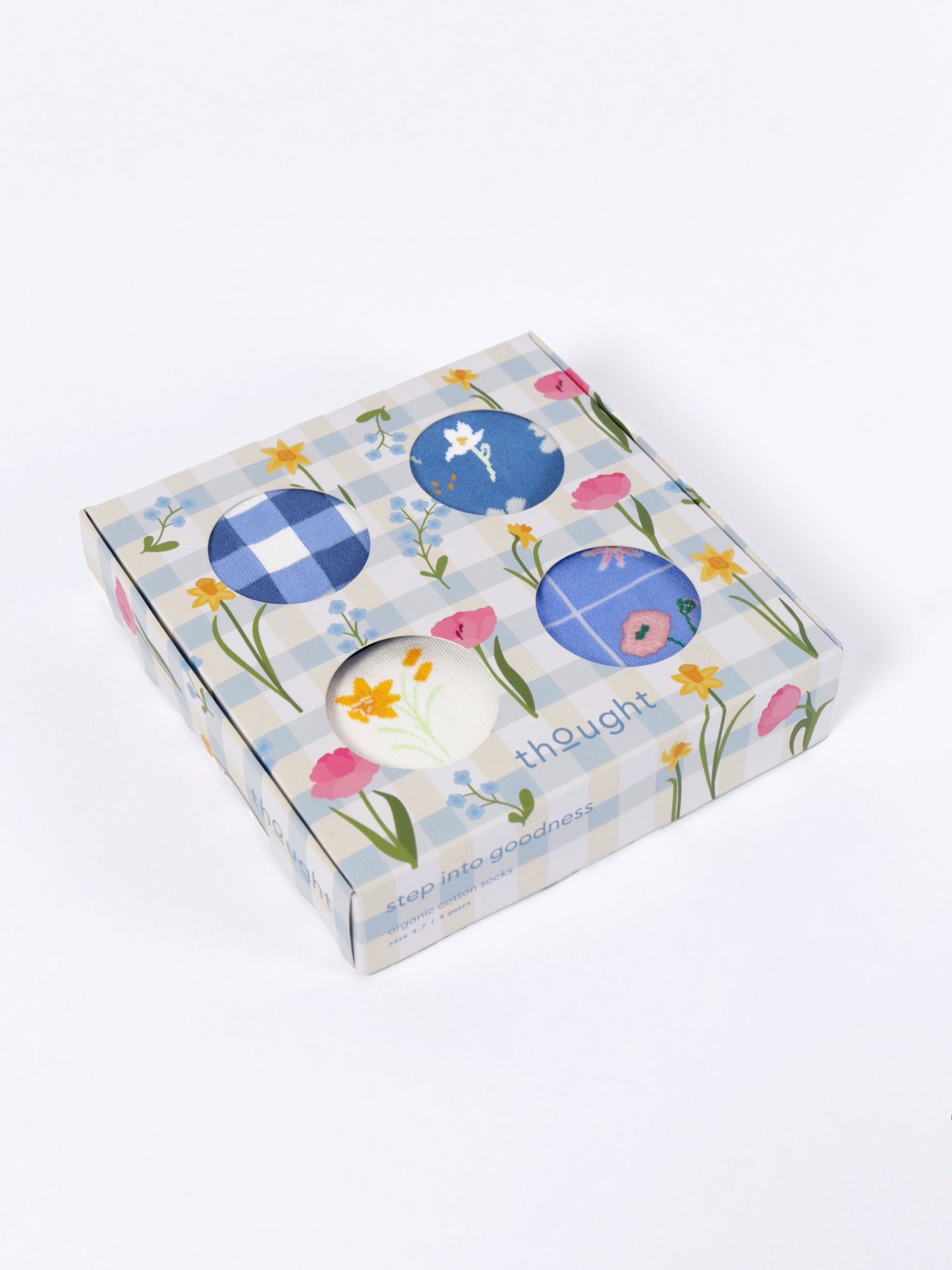Box with floral and blue circular designs on a white background