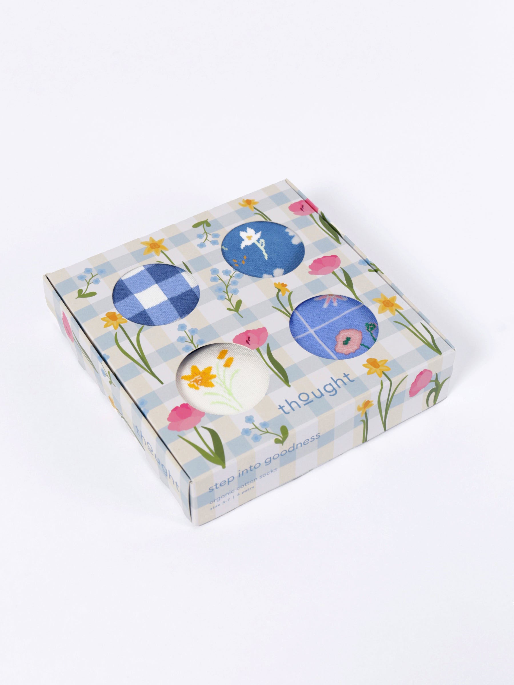 Box with floral and blue circular designs on a white background
