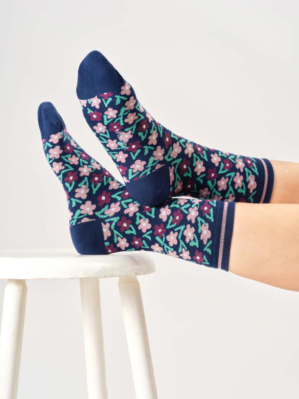 Floral patterned socks on a white background
