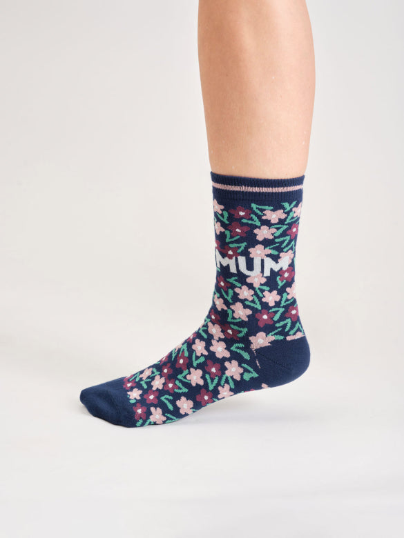 Navy sock with floral pattern and 'MUM' text on a white background