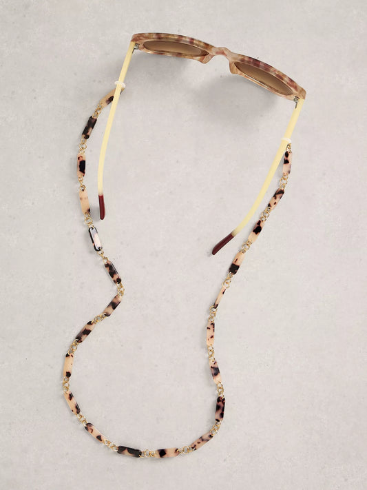 Sunglasses with a beaded chain on a light gray background