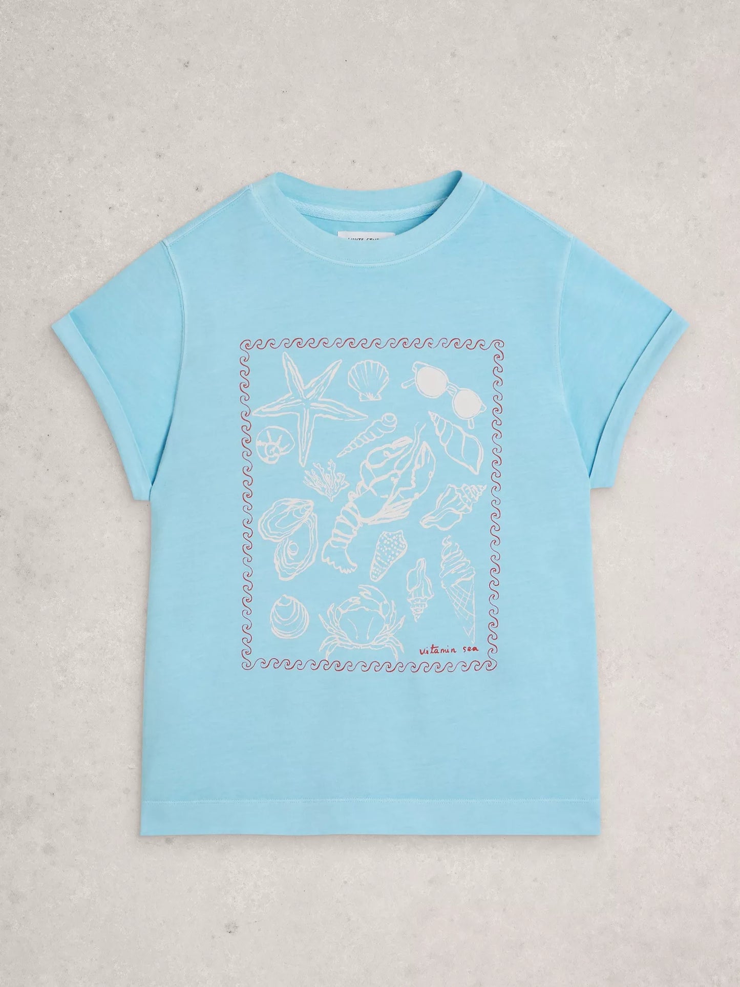 Light blue t-shirt with a graphic design on a light gray background