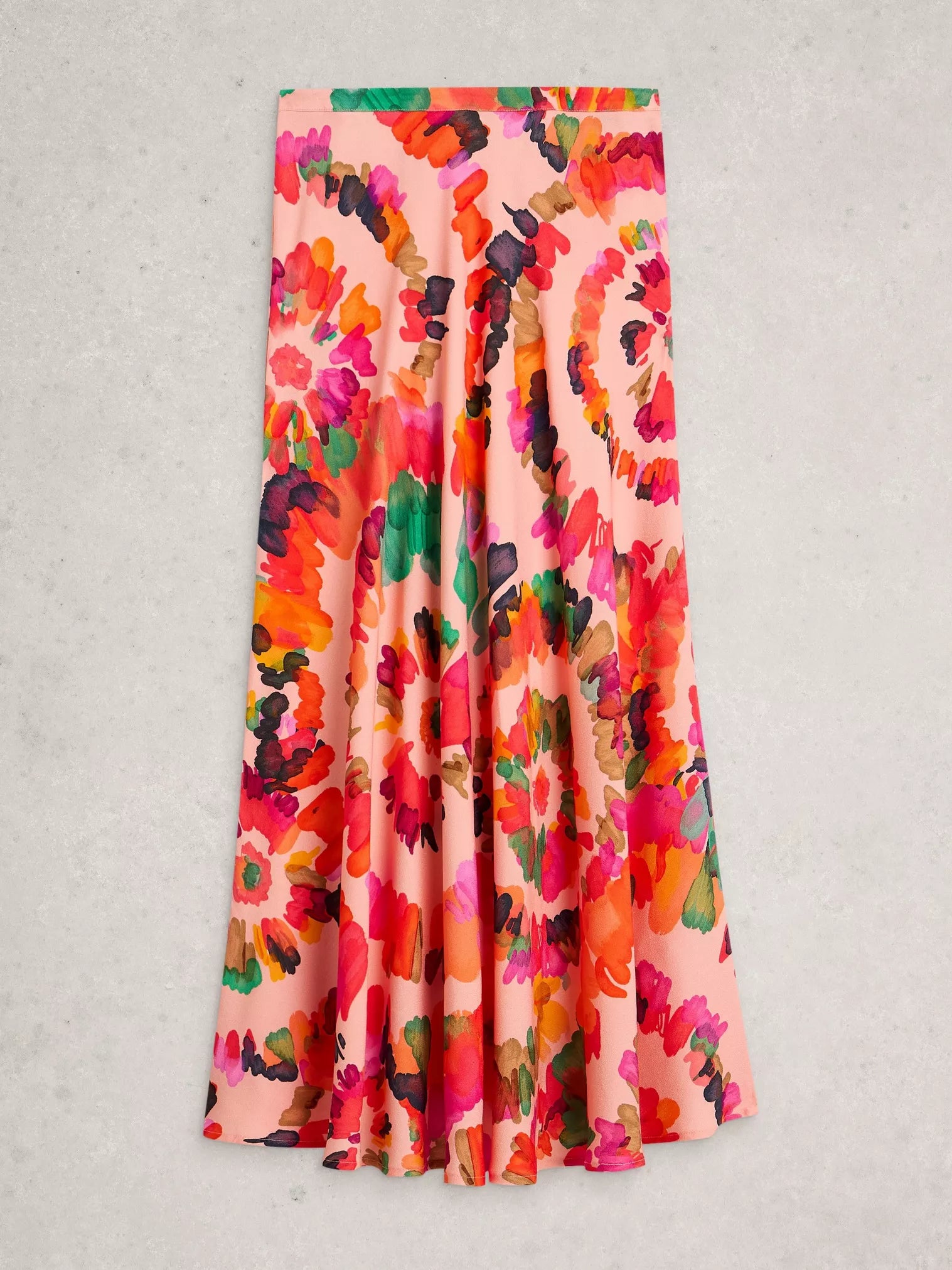 Colorful floral-patterned skirt on a light gray background