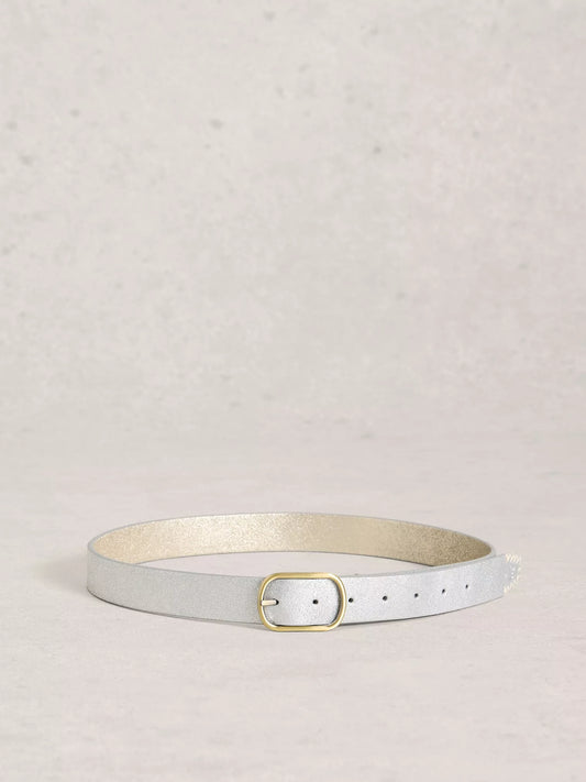 Silver leather belt with a gold buckle on a light grey background