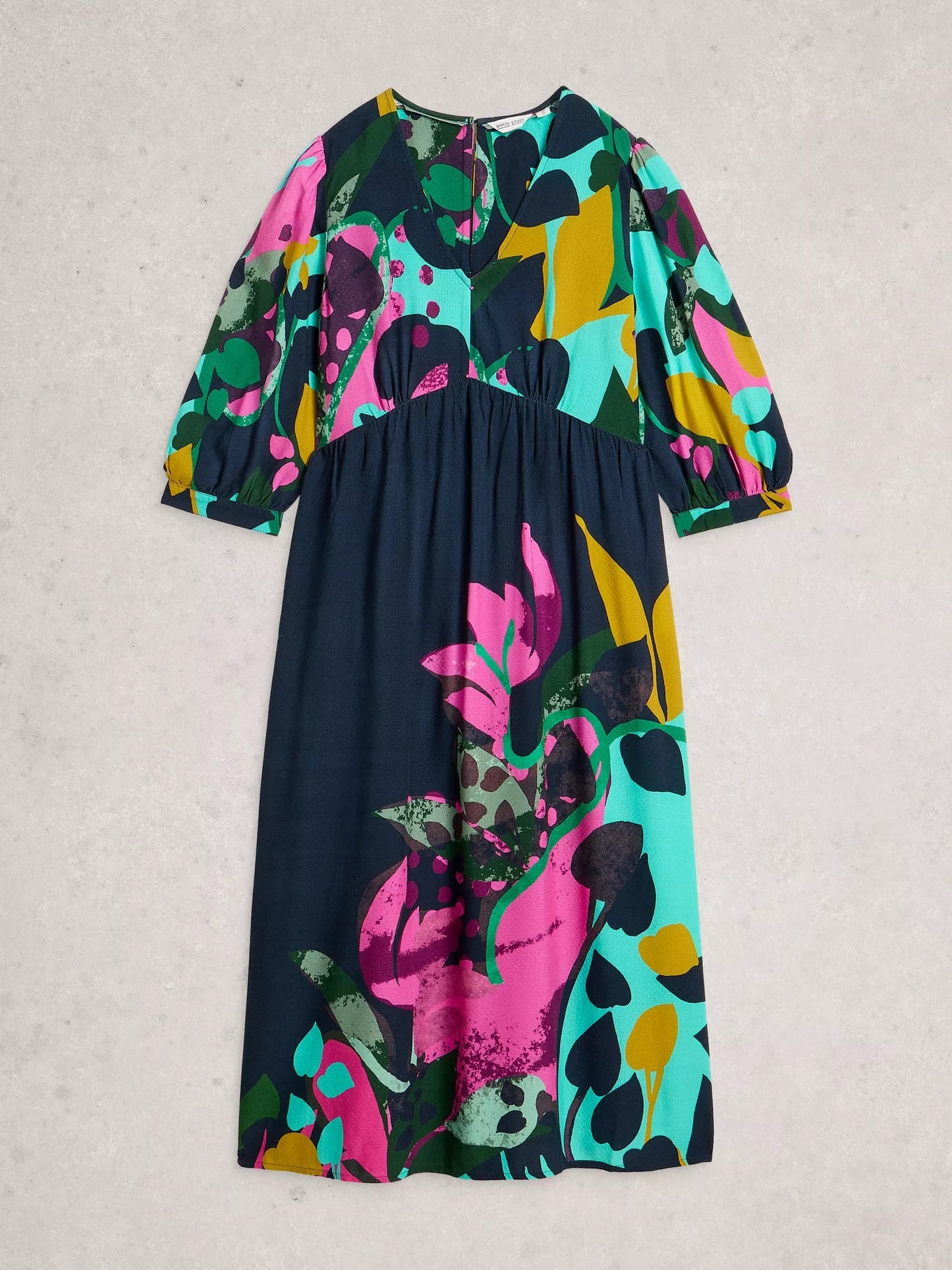 Colorful floral dress on a light gray background