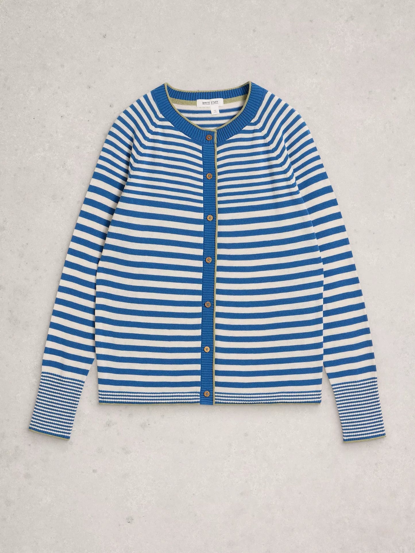 blue and white striped cardigan flat lay on a grey background 