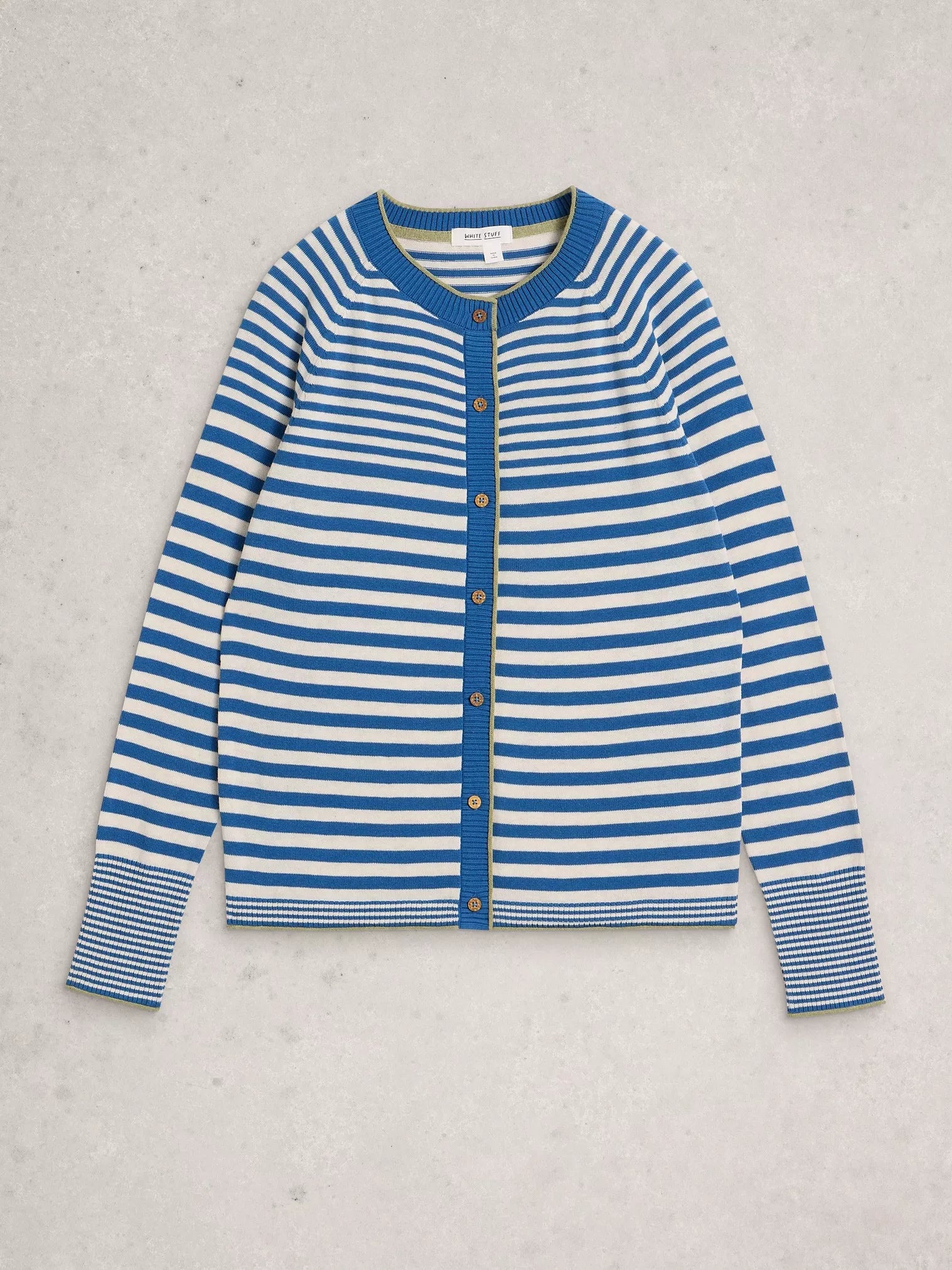 blue and white striped cardigan flat lay on a grey background 