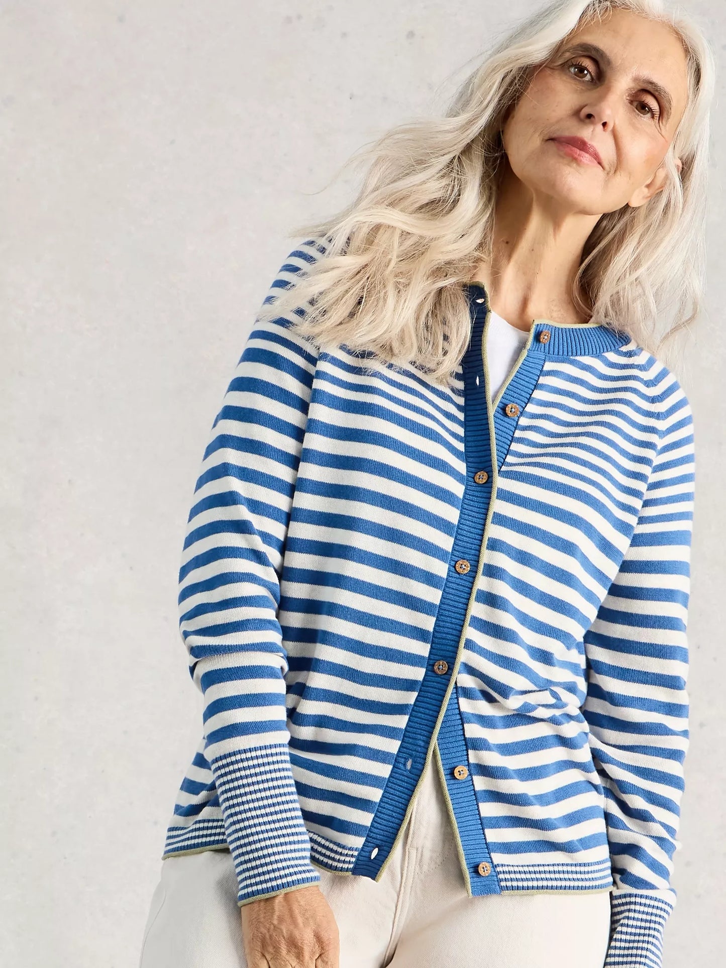 lady modelling blue and white striped cardigan