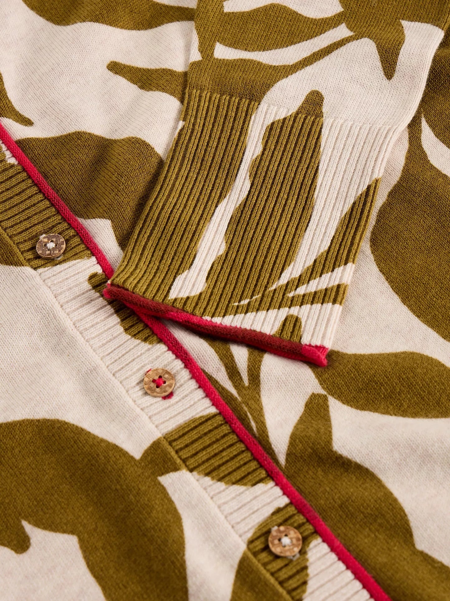 Close-up of a patterned fabric with brown and beige design on a white background