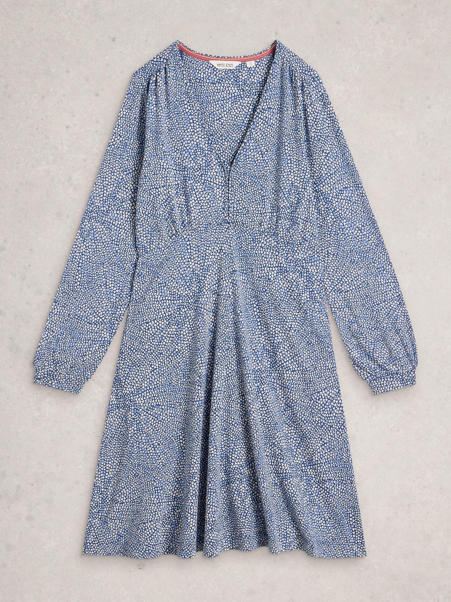 Flat lay of blue and white heart print dress