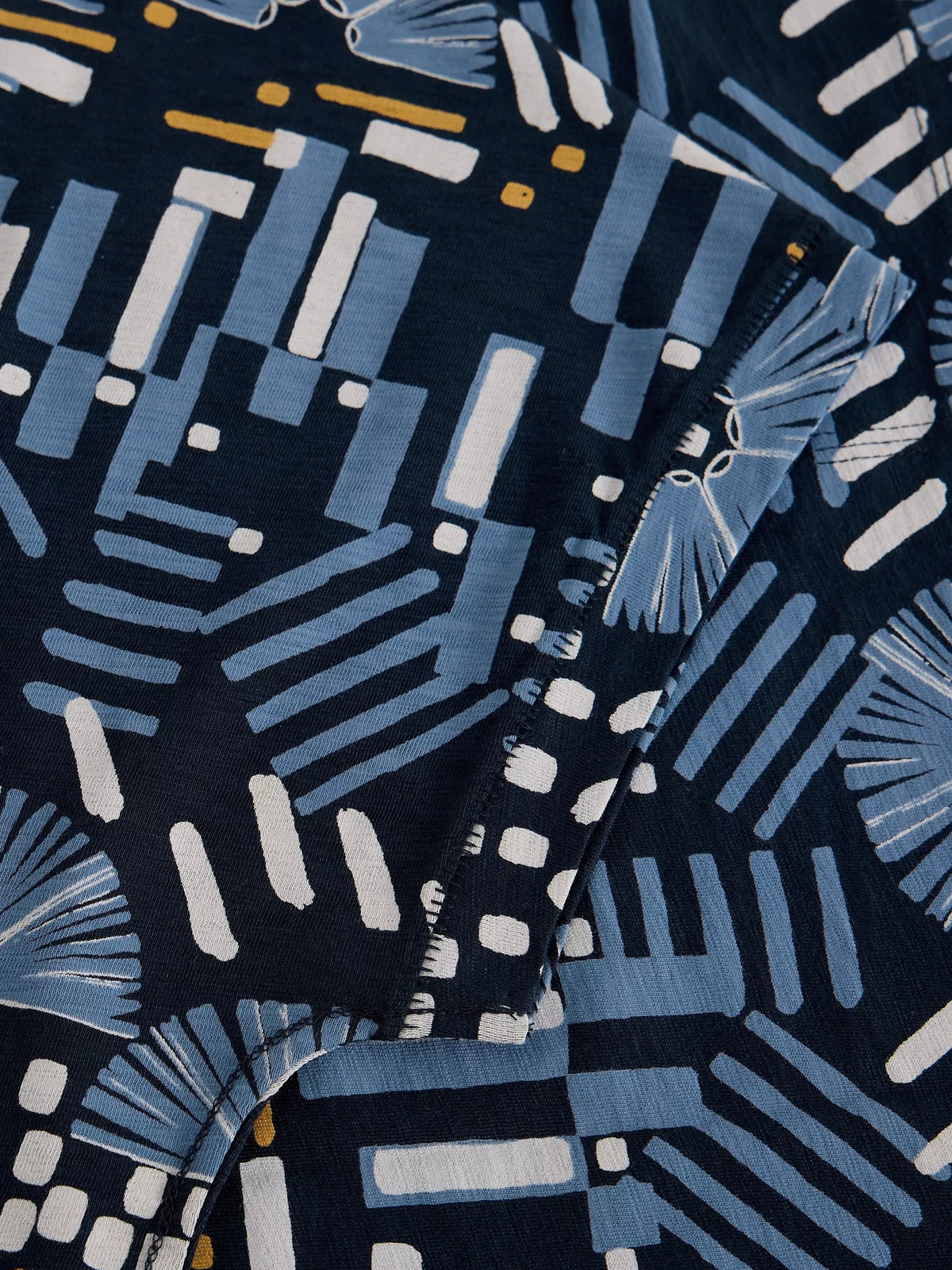 Close-up of fabric with blue and white abstract pattern