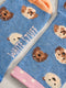 Blue socks with dog pattern and 'White Stuff' branding on a light background