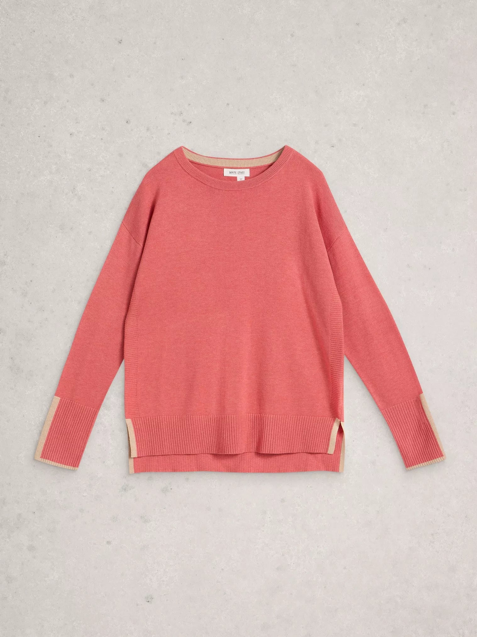 flatlay of a pink jumper