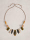 Necklace with multicolored beads on a light gray background
