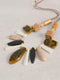 Necklace with wooden and tortoiseshell beads on a light gray background