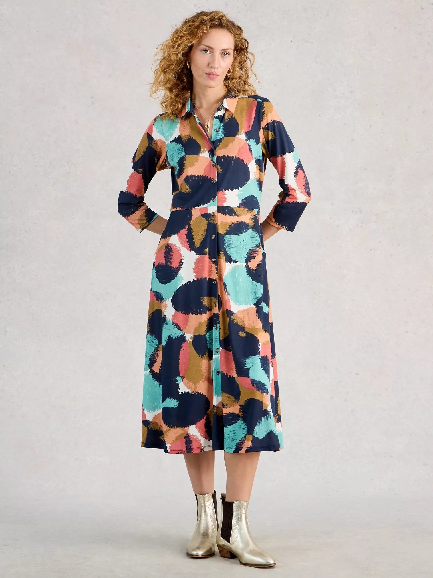 Model in multi coloured shirt dress