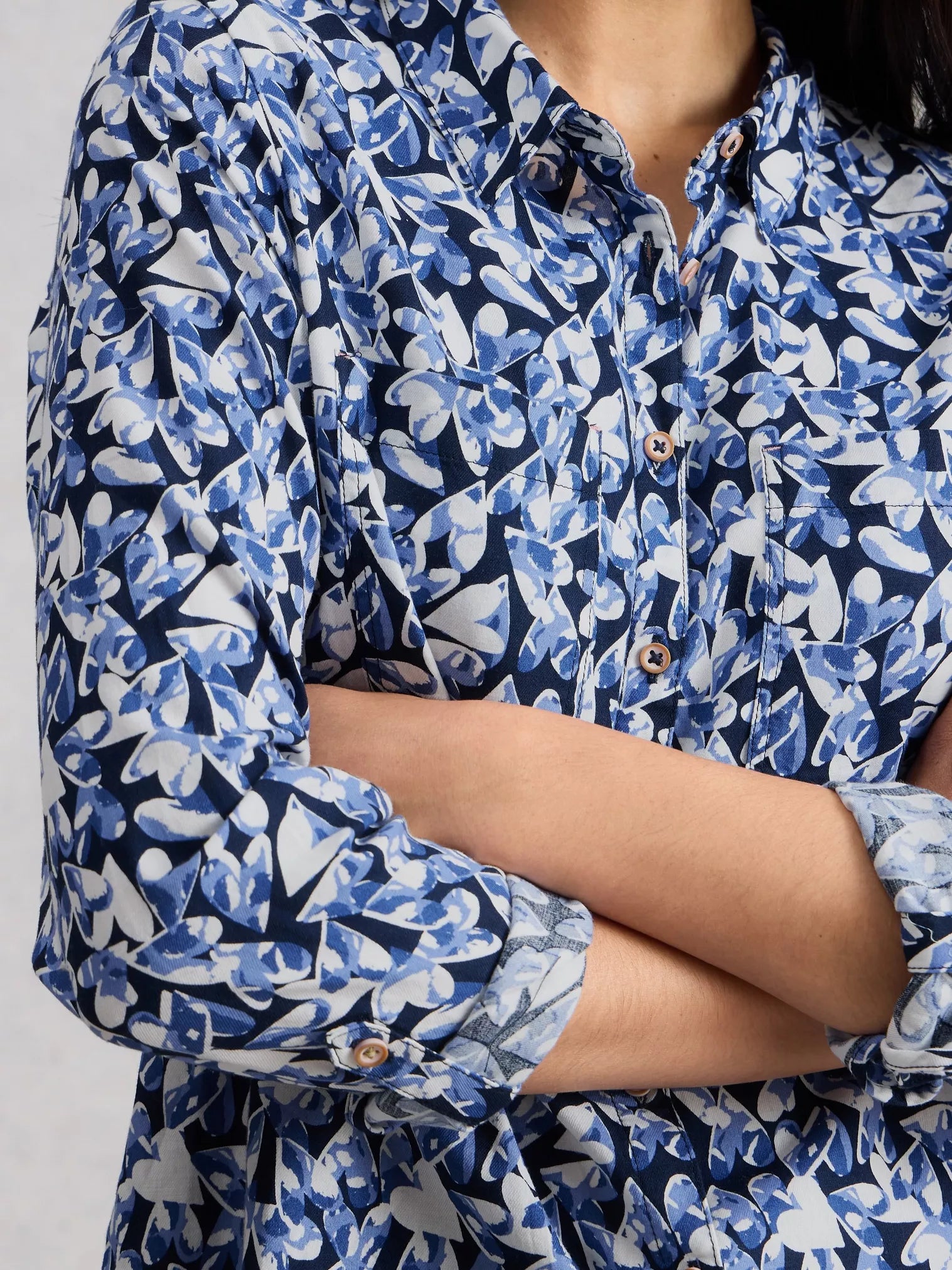 Close up of heart detail on navy shirt