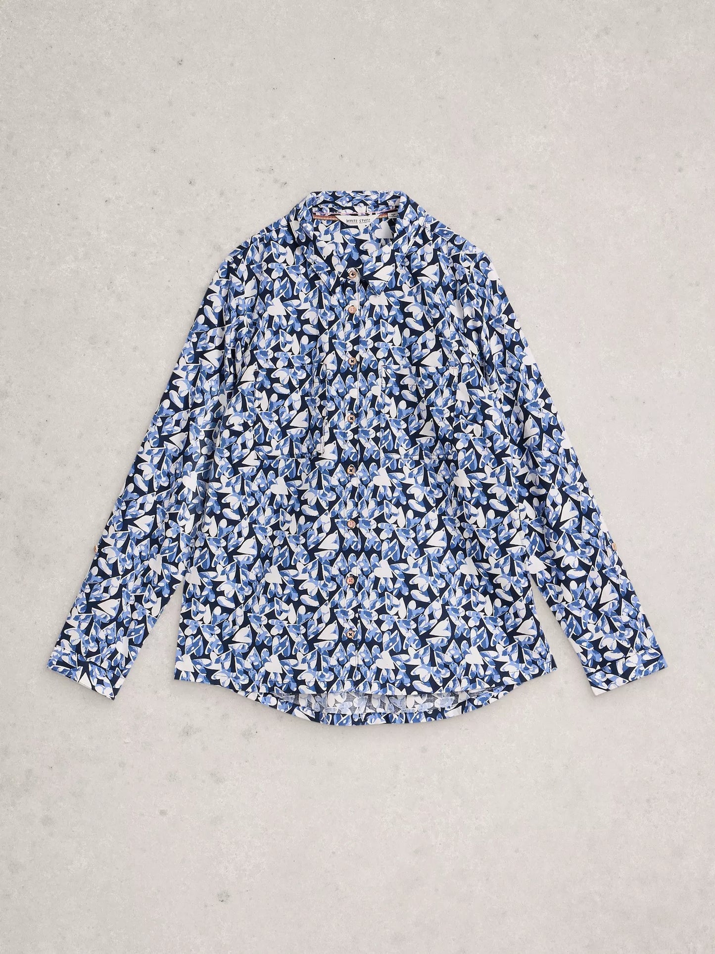 Flat lay of navy shirt with heart detail
