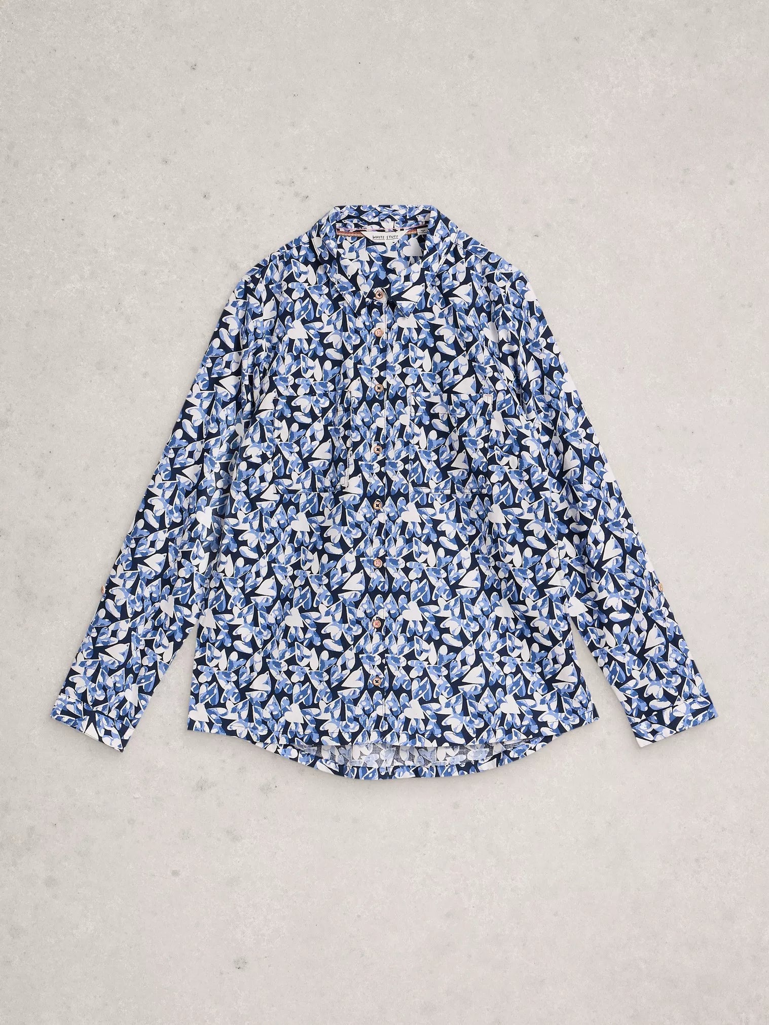 Flat lay of navy shirt with heart detail