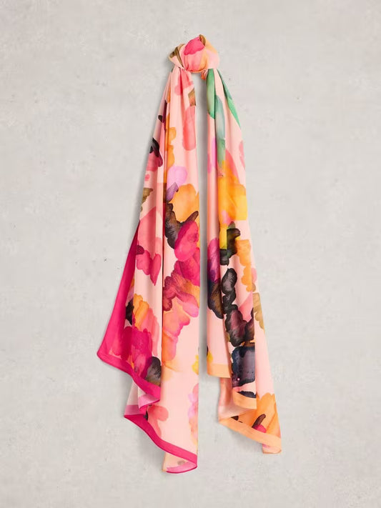 Floral scarf with pink, orange, and black colors on a light gray background