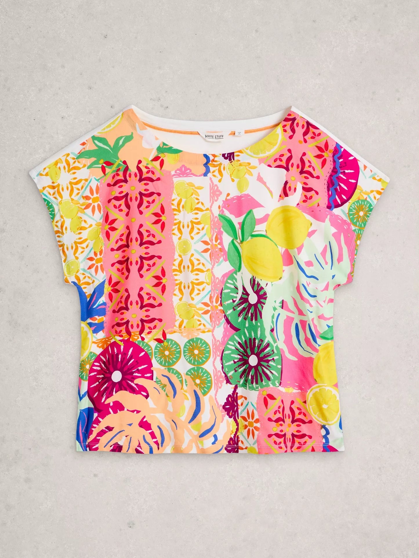 Colorful patterned t-shirt on a light gray background
