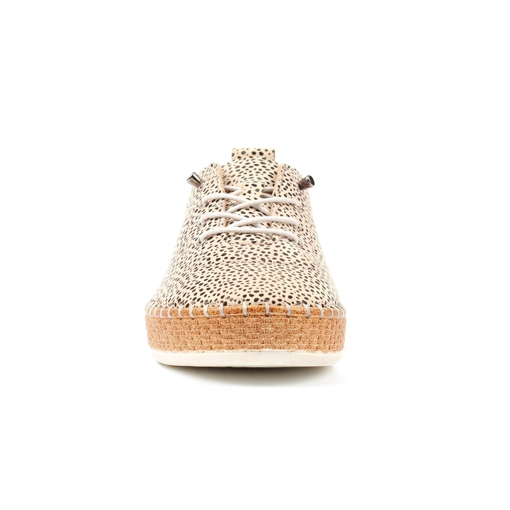 Beige sneaker with textured upper and cork sole on a white background