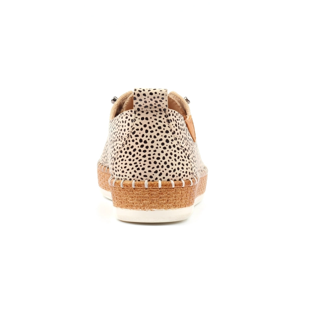 Sandal with spotted pattern on a white background